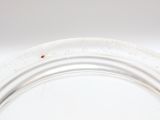 a close up of a white plate on a table