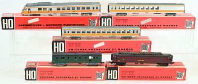 six train cars that are stacked up on a table