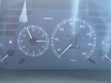 a close up of a car dashboard with a speedometer and other gauges