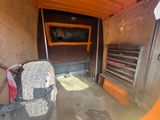 an image of a small room with a couch and other items