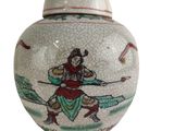 a white vase with a picture of a man holding a sword