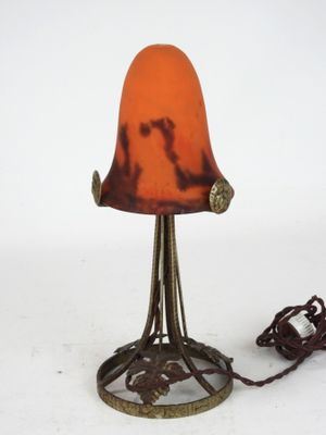 a lamp that is sitting on a table with a cord