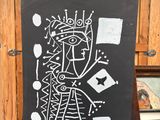 un tableau noir sur lequel est dessiné un homme
