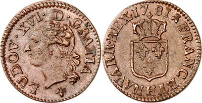 une vieille pièce de monnaie surmontée d'une couronne