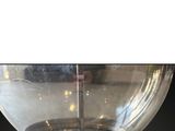 a glass bowl with a light on top of it