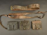 an image of a group of leather items sitting on top of a table
