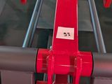 a red machine that is on display in a store