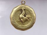 an image of a gold coin with a bird on it