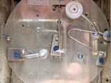 a close up of a clock with a lot of wires