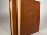 brown leather bound book with embosishments of a stop sign