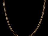 a gold chain on a black background