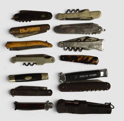 many different types of pocket knives on a white surface