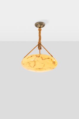 a close up of a light fixture on a white wall