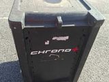 a black trash can sitting in the middle of a parking lot
