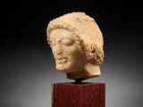 a roman marble head of a woman