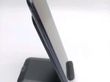 a close up of a cell phone on a stand