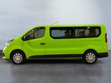 a green van that is parked in a parking lot