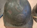two helmets that are sitting on a table