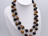a close up of a necklace on a mannequin mannequin