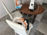 a table with two chairs and a table with a phone on it