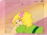 une image représentant une jeune fille de dessin animé aux cheveux blonds et vêtue d'une robe verte