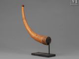 a wooden horn with a ladybug on top of it