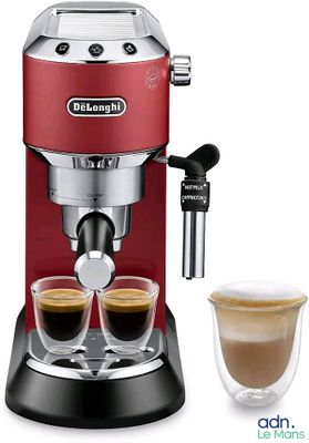 a close up of a coffee maker with two cups of coffee