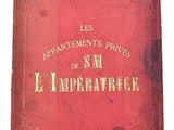 un vieux livre rouge orné d'inscriptions dorées, posé sur une surface blanche