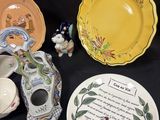 many different plates and bowls on a black table