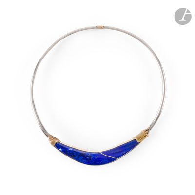 a close up of a blue necklace on a white background