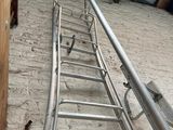 a ladder that is going up the side of a building