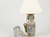 a lamp and a vase sitting next to each other on a table