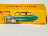 toy car in box on white surface with yellow background