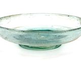 a glass bowl sitting on top of a white table