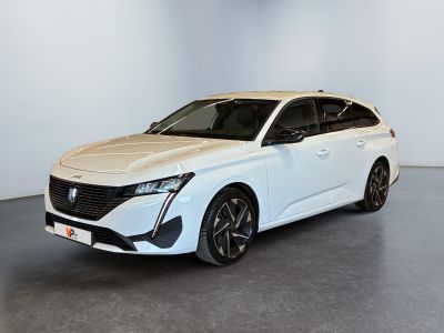 the white car is parked in a room with a gray floor
