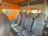 four seats in the back of a bus that is empty
