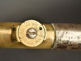 a close up of a brass pipe with a thermometer on it