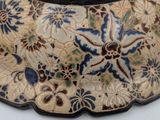 a close up of a vase with a blue and white design on it