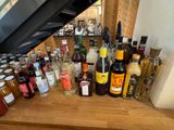 many bottles of alcohol on a wooden table