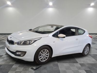 the white car is parked on a checkered tile floor