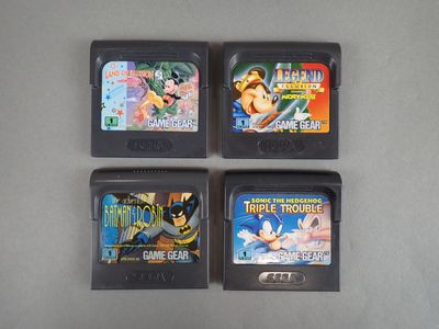 three nintendo gameboy games sitting on top of a table