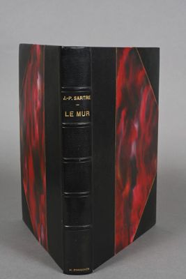 an image of a book with a red cover and black binding