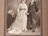 a black and white photo of a man and a woman holding hands