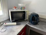 a microwave and a toaster sitting on a counter in a kitchen