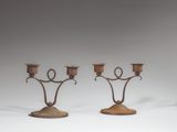 pair of antique iron candelabs with candle holders