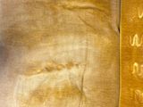 a close up of a piece of cloth with writing on it
