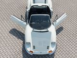 an overhead view of a white sports car parked on a brick road