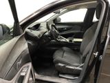 the interior of a car with the door open and the driver ' s seat down