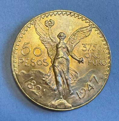 l'image d'une pièce d'or ornée d'un ange