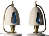 two lamps that are on top of a table